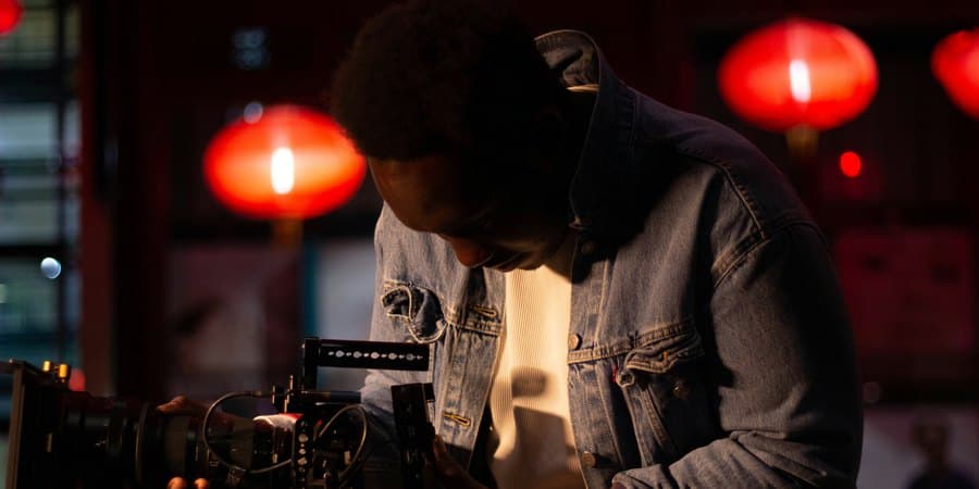 Videographer filming at night