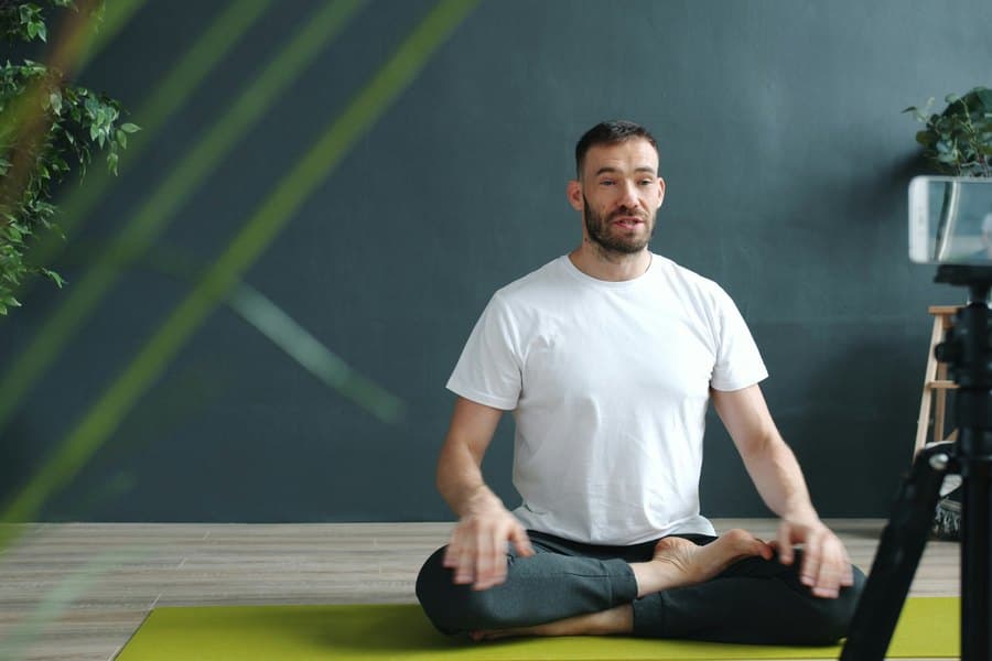 Fitness coach filming a session